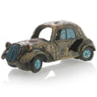 Vintage-style toy car with a distressed finish on a white background