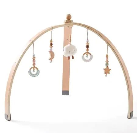 Wooden baby arch with hanging beads and toys on a white background