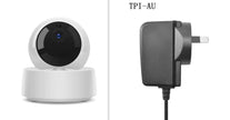 Smart home camera and power adapter on a white background