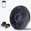 Black exercise device with blue lights and gloves on a white background