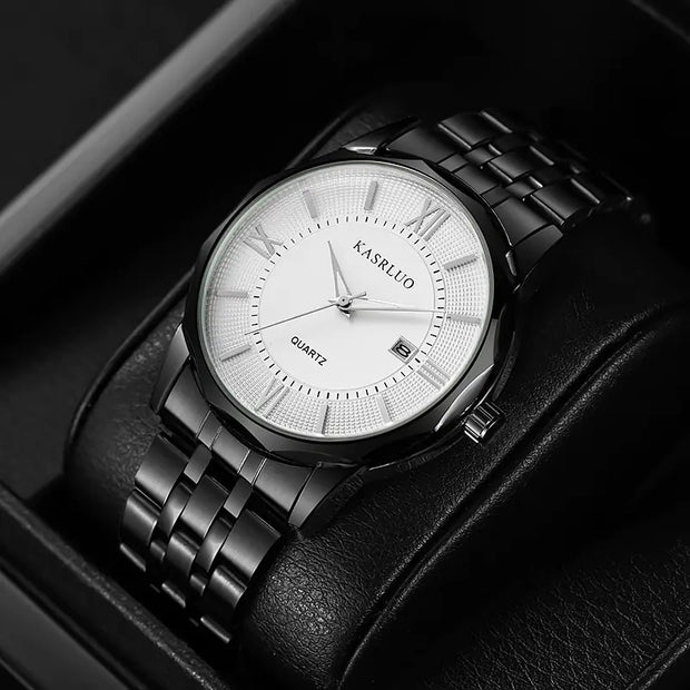 Black wristwatch with white face on a black leather strap, displayed in a box.