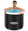 Person relaxing in a black inflatable bathtub with Xumano branding, on a white background.
