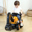 Child playing with a toy bulldozer indoors