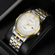 Luxury watch with silver and gold band on a dark background