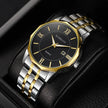 Luxury watch with gold and silver band on a black background